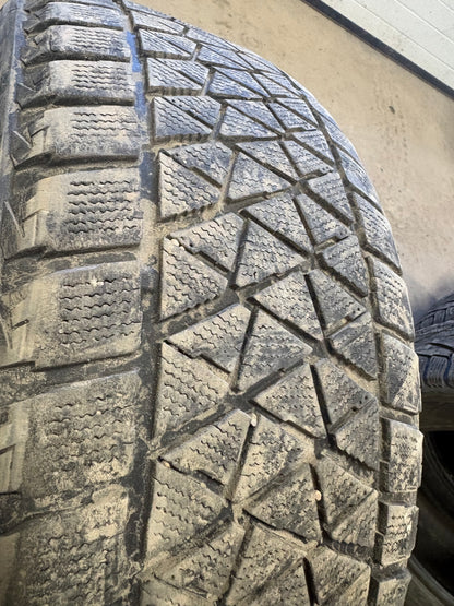 4 pneus d hiver 255/50r20 Bridgestone en bon etat